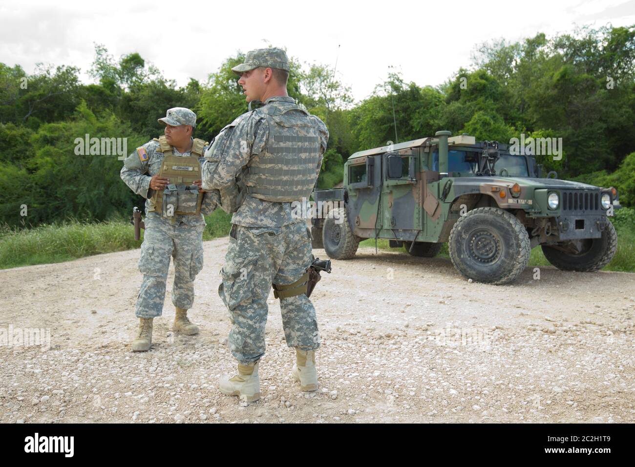 Texas Border Law Enforcement - National Guard troops do a shift change on the Rio Grande levee near Anzalduas Park in Granjeno, TX south of Mission in Hidalgo County.  Texas Governor Rick Perry ordered troops on the border to supplement federal law enforcement.   © Bob Daemmrich Stock Photo
