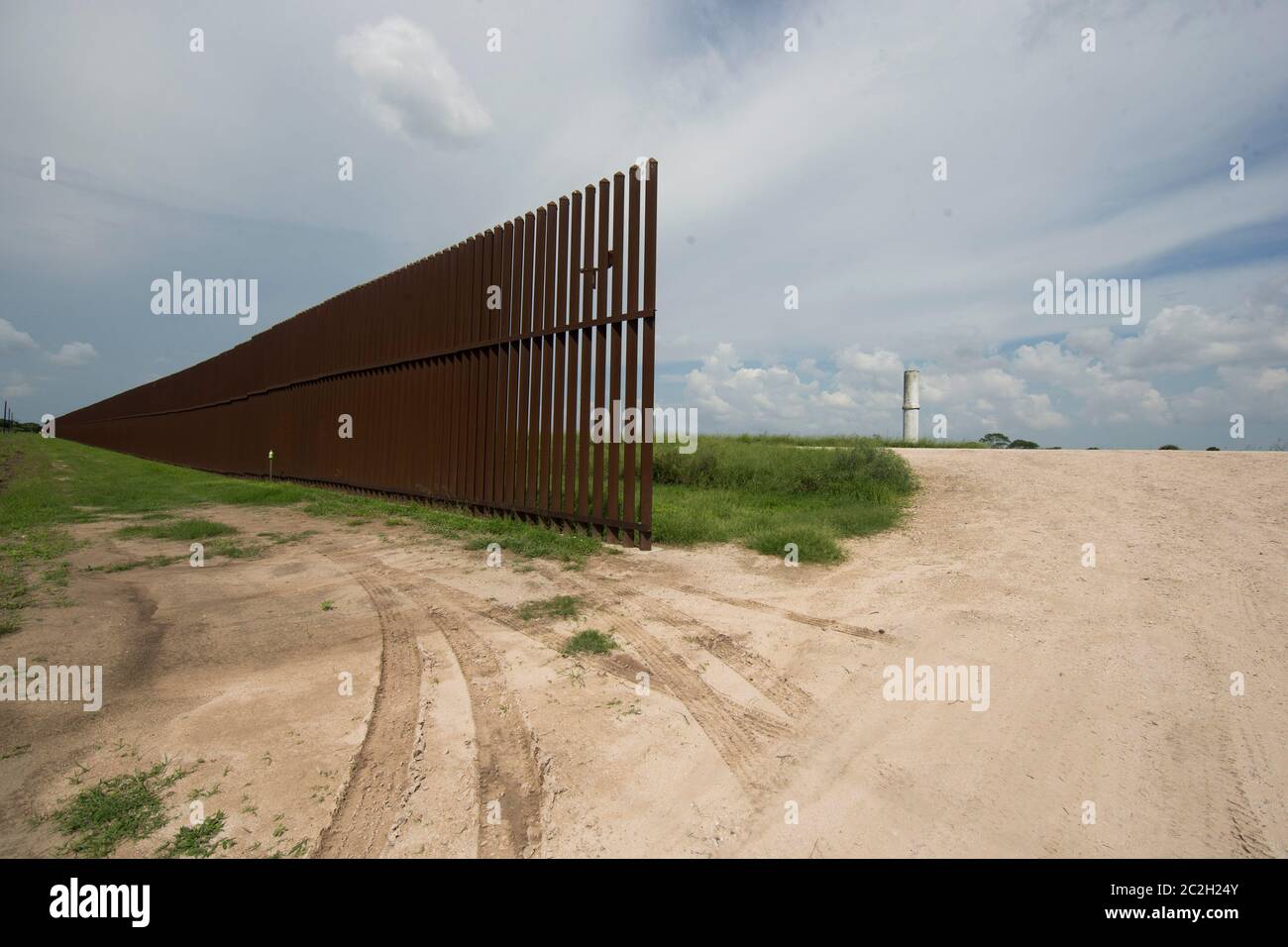 Cameron County Texas USA, September 23, 2014 The border wall runs several miles through a rural