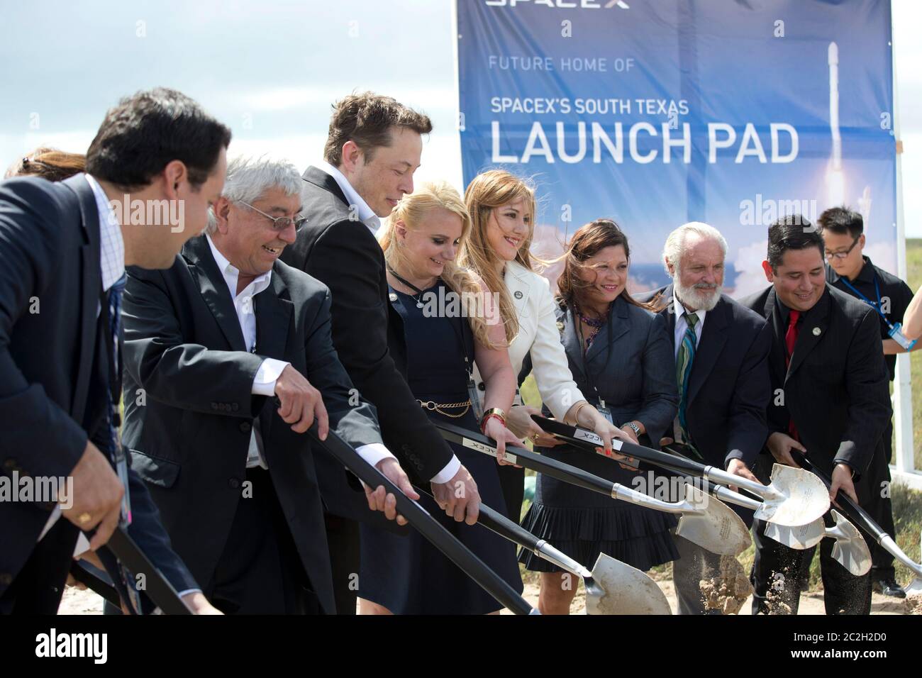 Boca Chica Texas USA, September 23, 2014:SpaceX CEO Elon Musk (third from left) helps break ground on the site of the company's new space port in far south Texas. SpaceX COO Gwynne Shotwell is fifth from left. The remote location east of Brownsville, Texas, is two miles from the mouth of the Rio Grande River and Texas' border with Mexico.  ©Bob Daemmrich Stock Photo