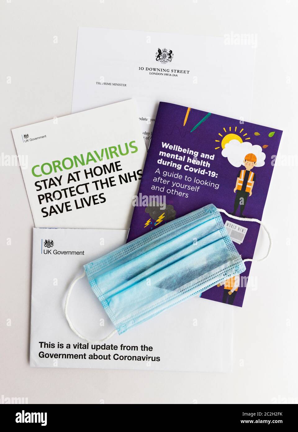 Letter from UK government and booklet issued during the 2020 Coronavirus pandemic. Stock Photo