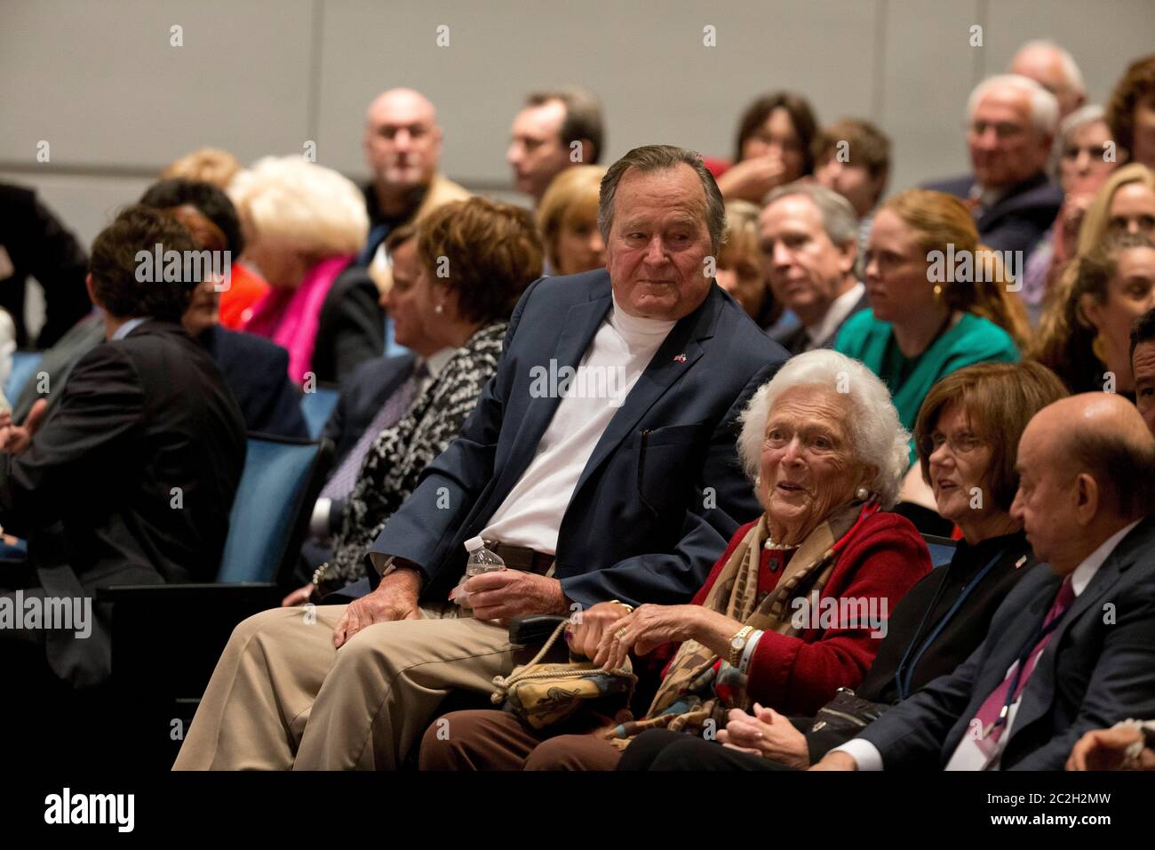 College Station, Texas USA, November 11 2014: Former U.S. President George H. W. Bush listens with his wife, Barbara Bush, as his son former President George W. Bush talks about his new book, '41: A Portrait of My Father'  during a book event at the Bush Library at Texas A&M University.   ©Bob Daemmrich Stock Photo