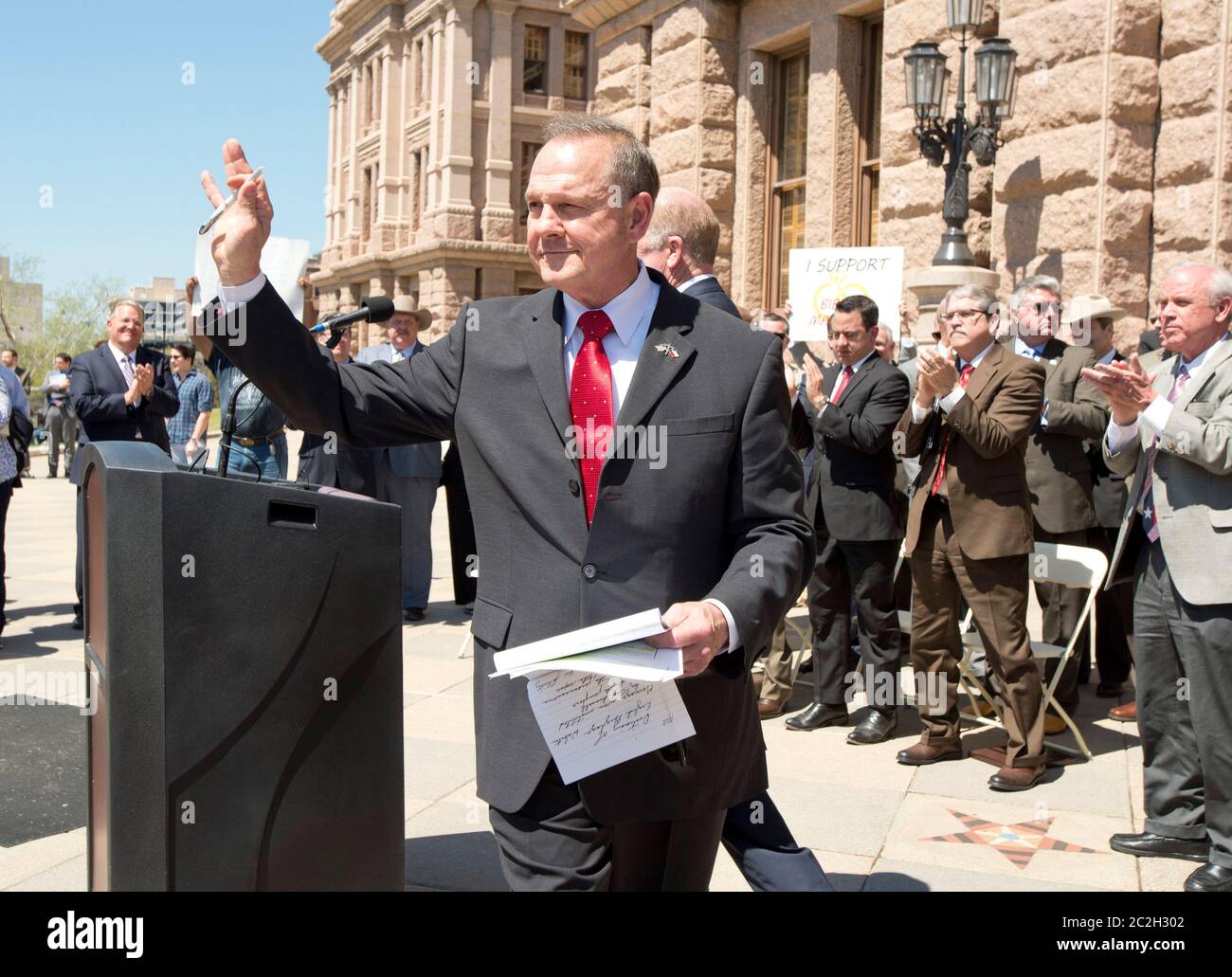Austin Texas USA, March 24 2015: Controversial Alabama Supreme Court Chief Justice Roy Moore waves to the crowd after speaking alongside conservative Texas legislators opposing gay marriage at a Texas Capitol rally.  Moore has told Alabama judges to ignore a recent federal court ruling allowing gay marriage in the state.   ©Bob Daemmrich Stock Photo