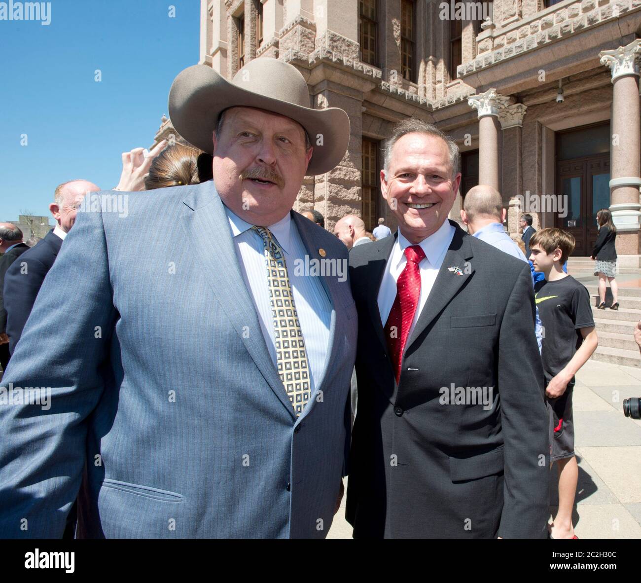 Austin Texas USA, March 24 2015: Controversial Alabama Supreme Court Chief Justice Roy Moore poses with Texas State Rep. Cecil Bell Jr. after speaking alongside conservative Texas legislators opposing gay marriage at a Texas Capitol rally.  Moore has told Alabama judges to ignore a recent federal court ruling allowing gay marriage in the state.   ©Bob Daemmrich Stock Photo