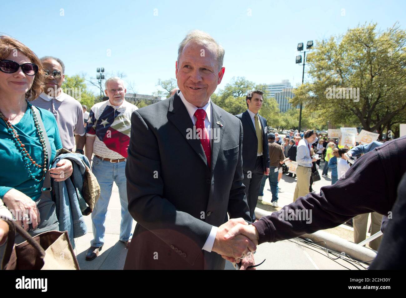 Austin Texas USA, March 24 2015: Controversial Alabama Supreme Court Chief Justice Roy Moore shakes hands after speaking alongside conservative Texas legislators opposing gay marriage at a Texas Capitol rally.  Moore has told Alabama judges to ignore a recent federal court ruling allowing gay marriage in the state.   ©Bob Daemmrich Stock Photo