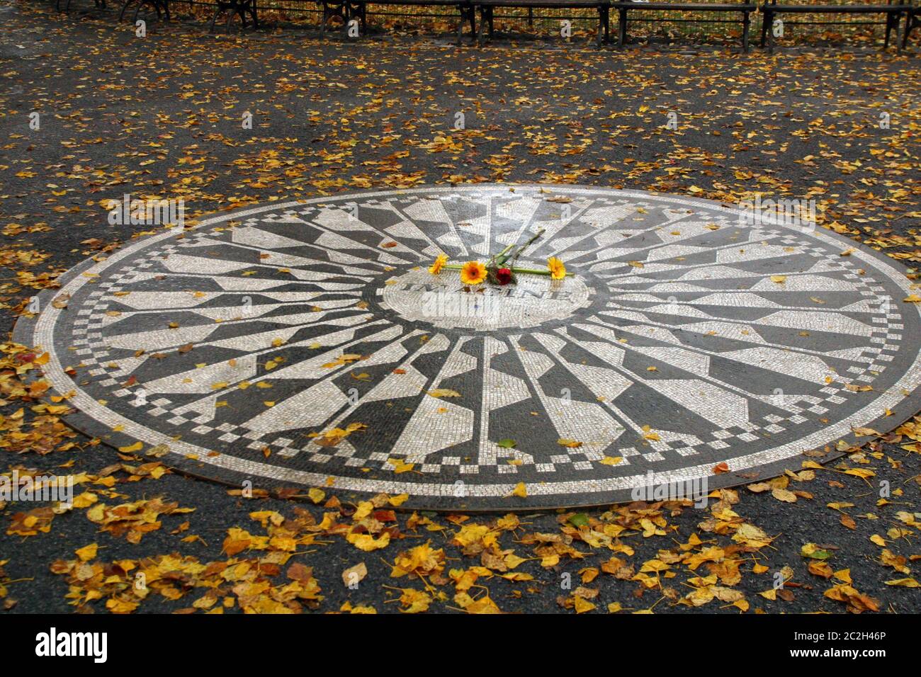 Just a short distance form the Dakota Building is the Central Park Memorial Strawberry Fields to the late John Lennon from the Beatles Stock Photo