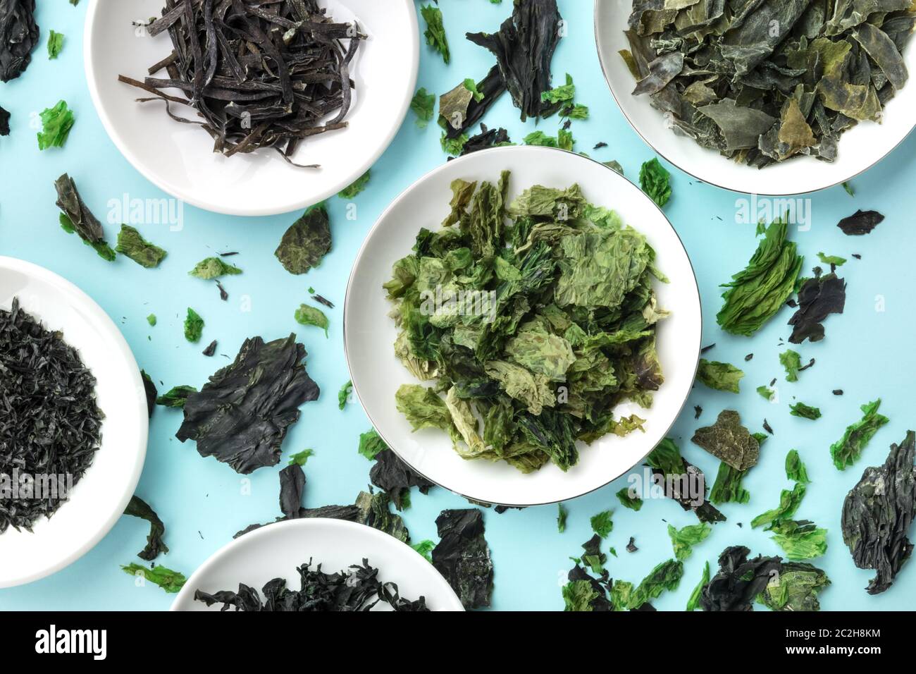 Dry seaweed, sea vegetables, top shot on a teal background Stock Photo