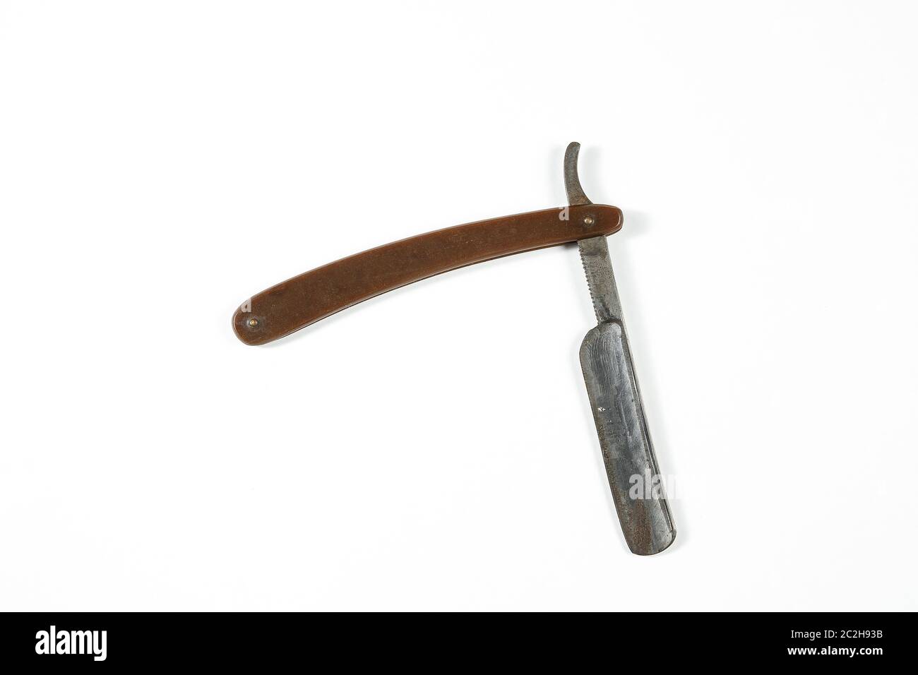 dangerous vintage shaving blade on white isolated background Stock Photo