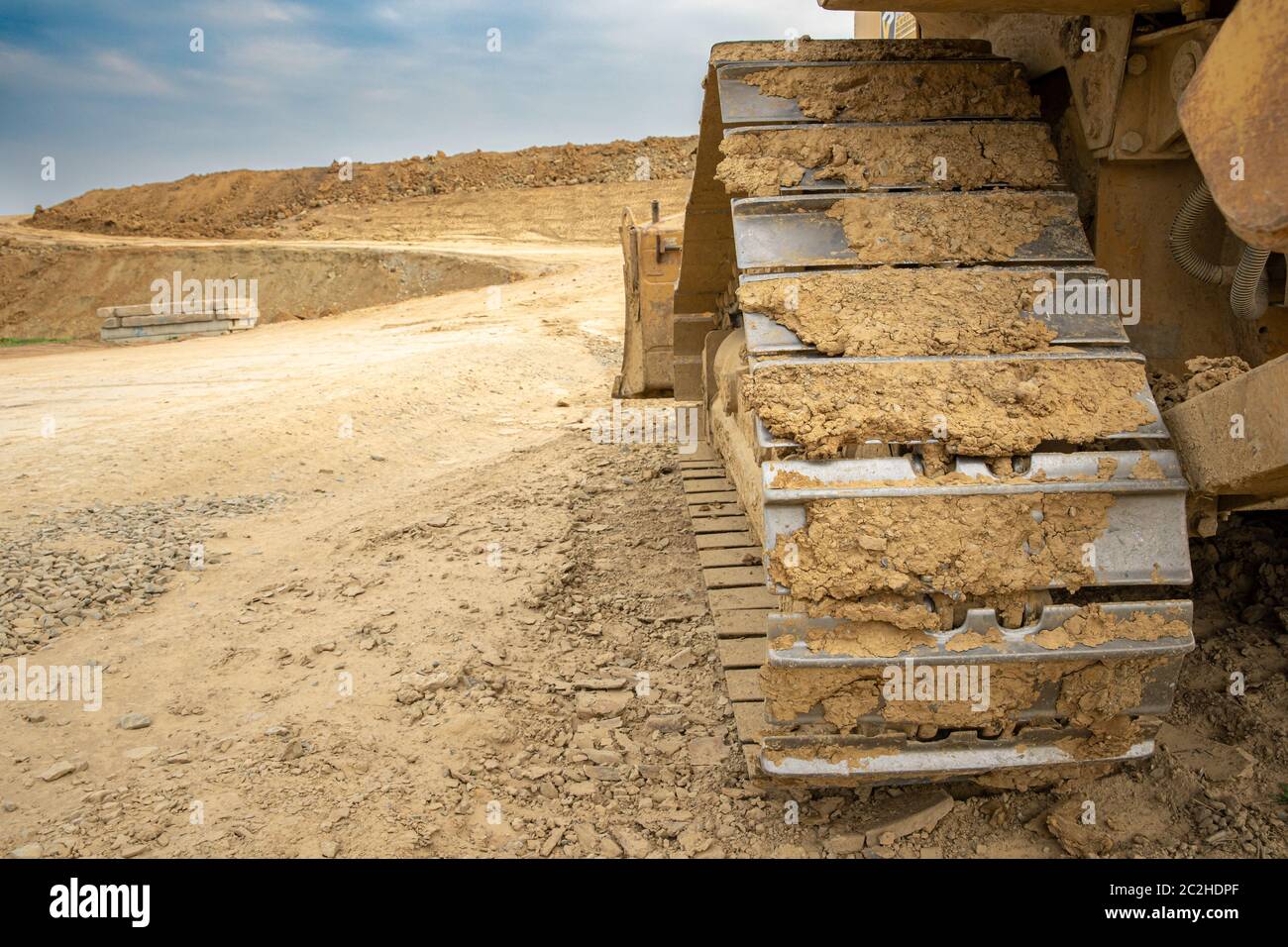 excavator summarizes soil on construction site in summer season Stock ...