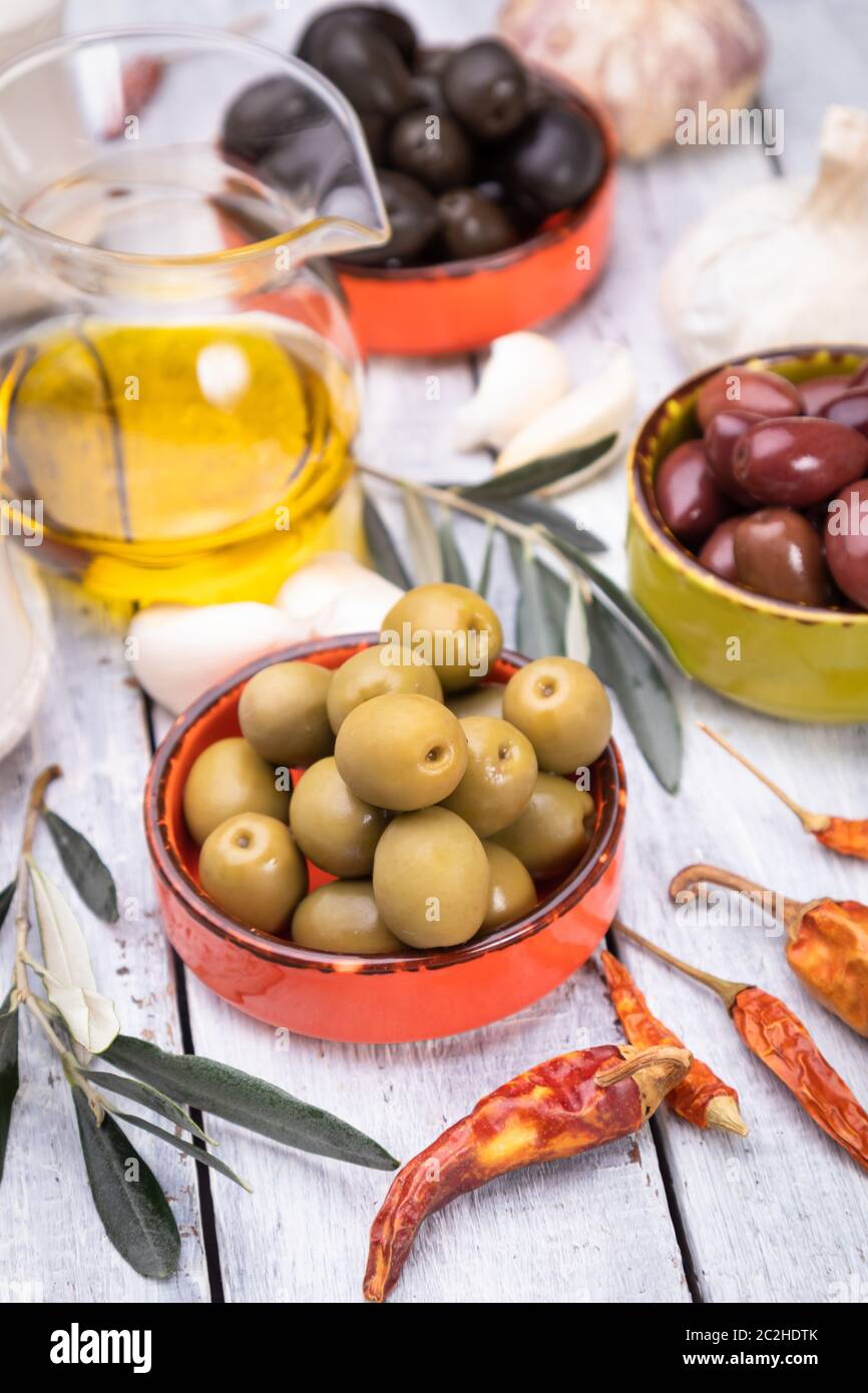Pickled olives ready to eat, healthy food used in mediterranean cuisines Stock Photo