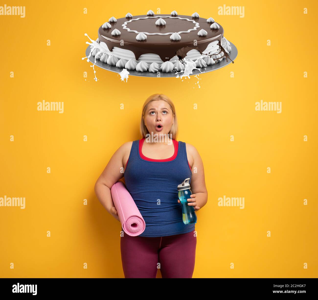 Fat girl thinks to eat sweets instead of do gym. yellow background Stock Photo