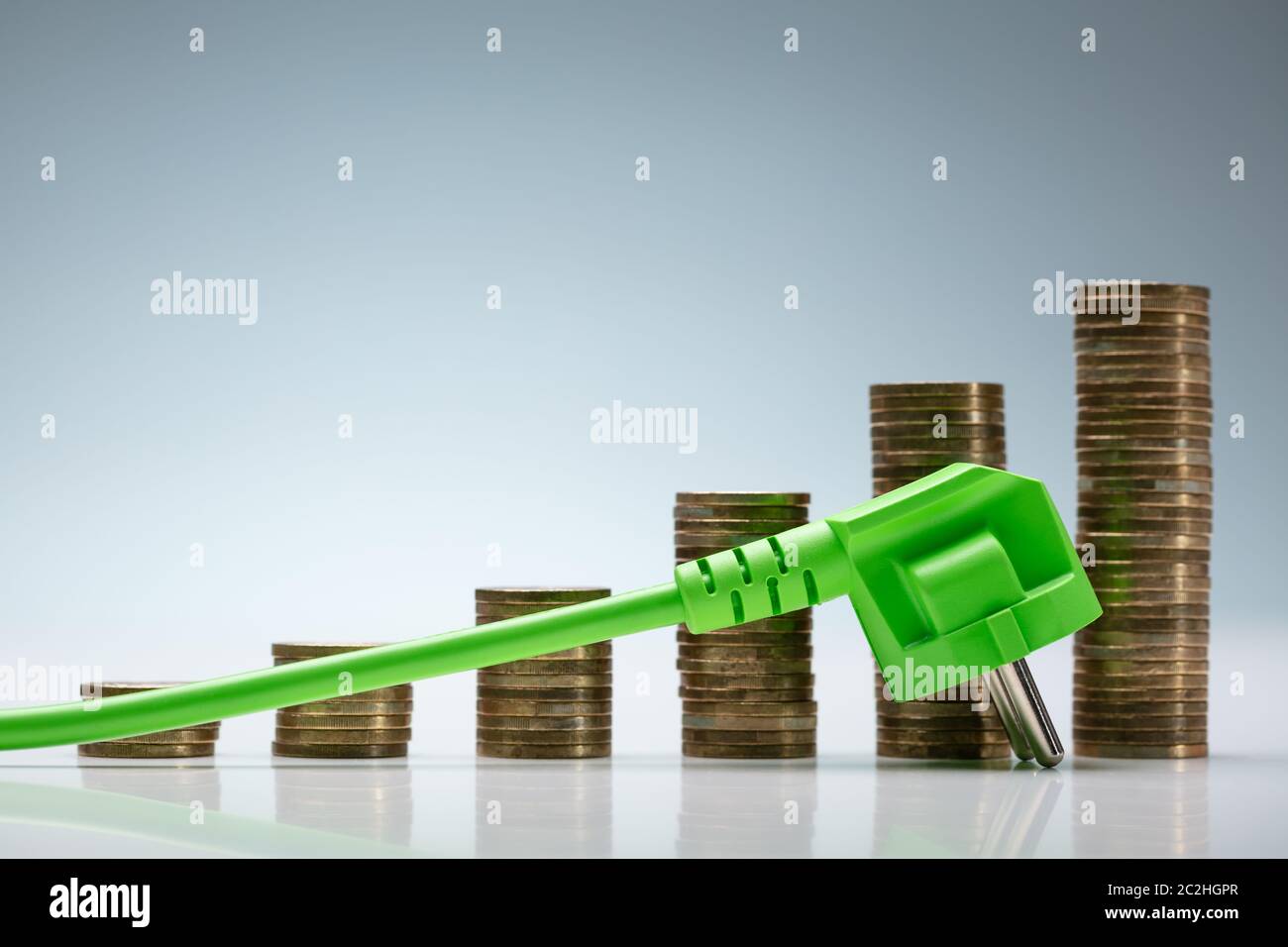 Energy Prices Chart Using Coin Stacks And AC Power Plug Stock Photo Alamy