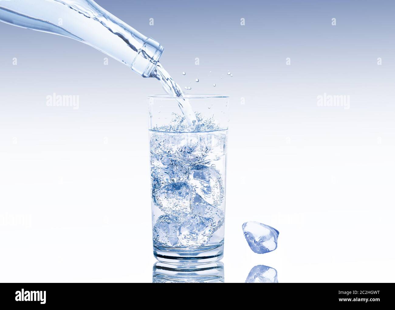 A water glass full of ice cubes is filled with fresh water Stock Photo ...