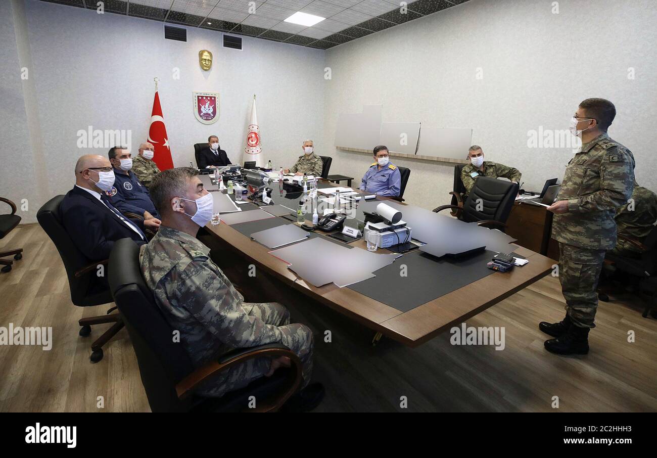 Ankara. 17th June, 2020. Turkish Defense Minister Hulusi Akar (5th R) attends a meeting with other commanders at the Army Command Control Center in Ankara, Turkey, on June 17, 2020. Turkey has launched Operation Claw-Tiger in northern Iraq with its commando forces supported by air elements, Turkish Defense Ministry announced on Wednesday. Credit: Xinhua/Alamy Live News Stock Photo