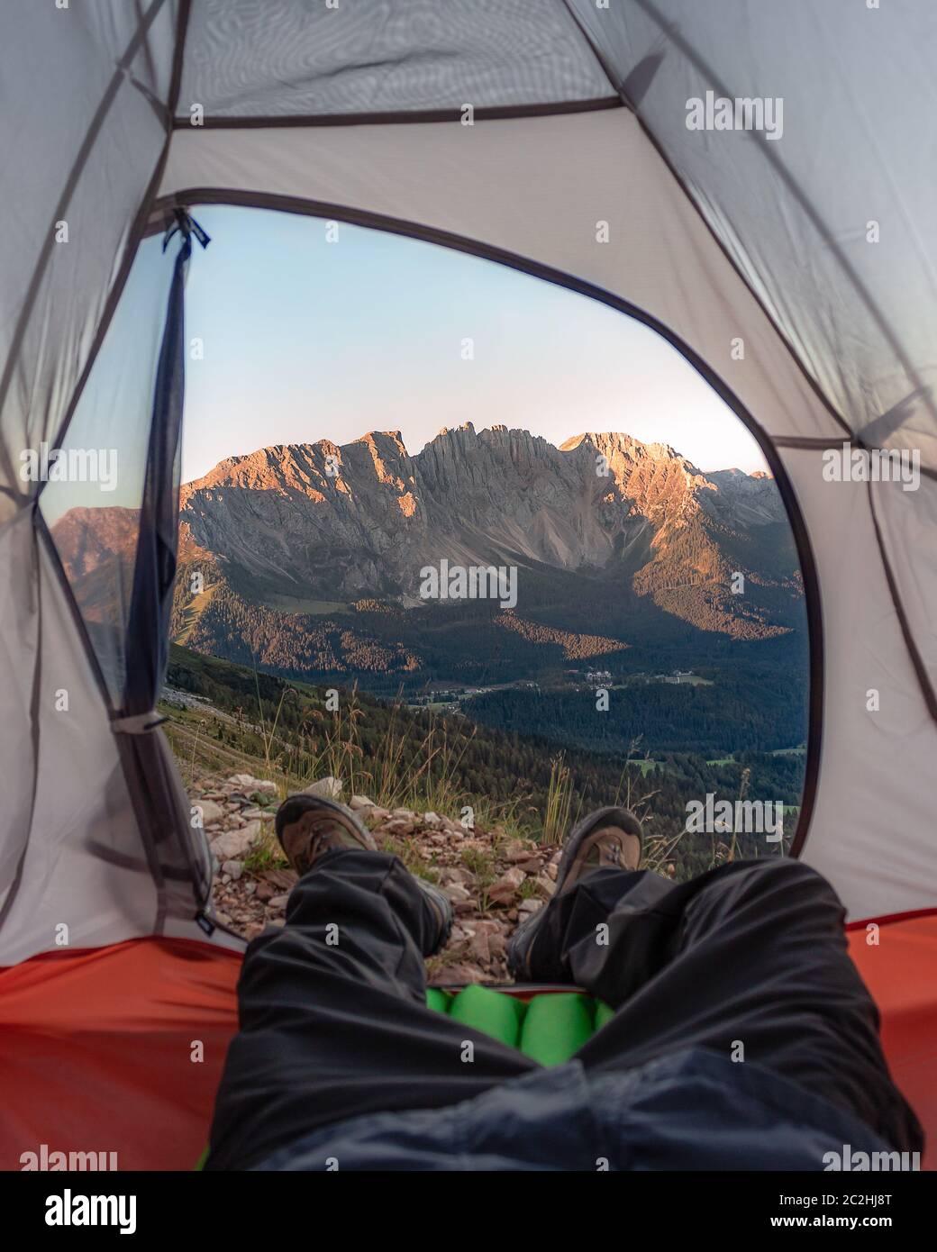 View on Latemar Dolomites from a tent. Camping in the Italian Dolomiti. Stock Photo