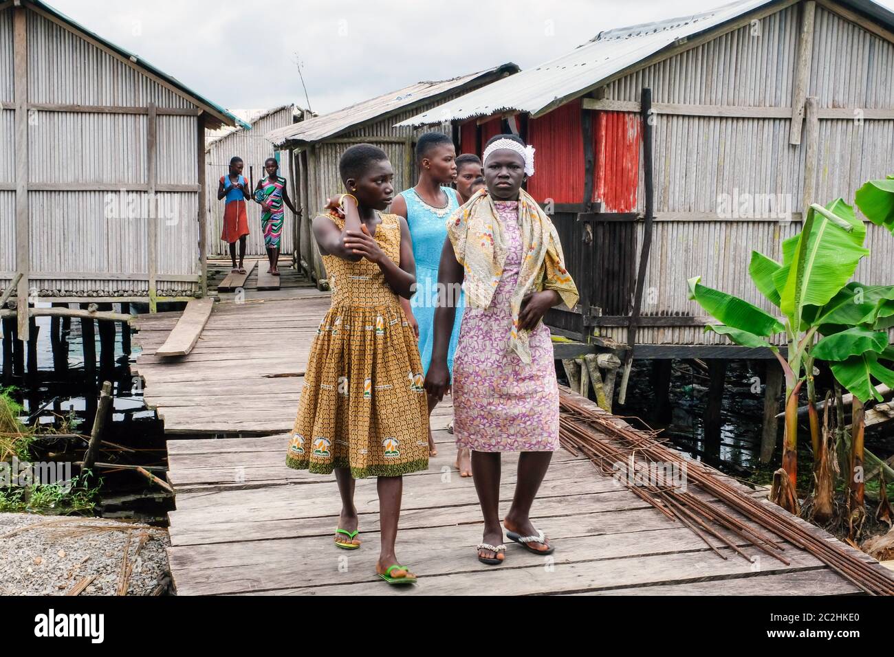Inhabitants of the wooden huts of the stilt village of Nzulezo in Lake Amansura / Ghana Stock Photo