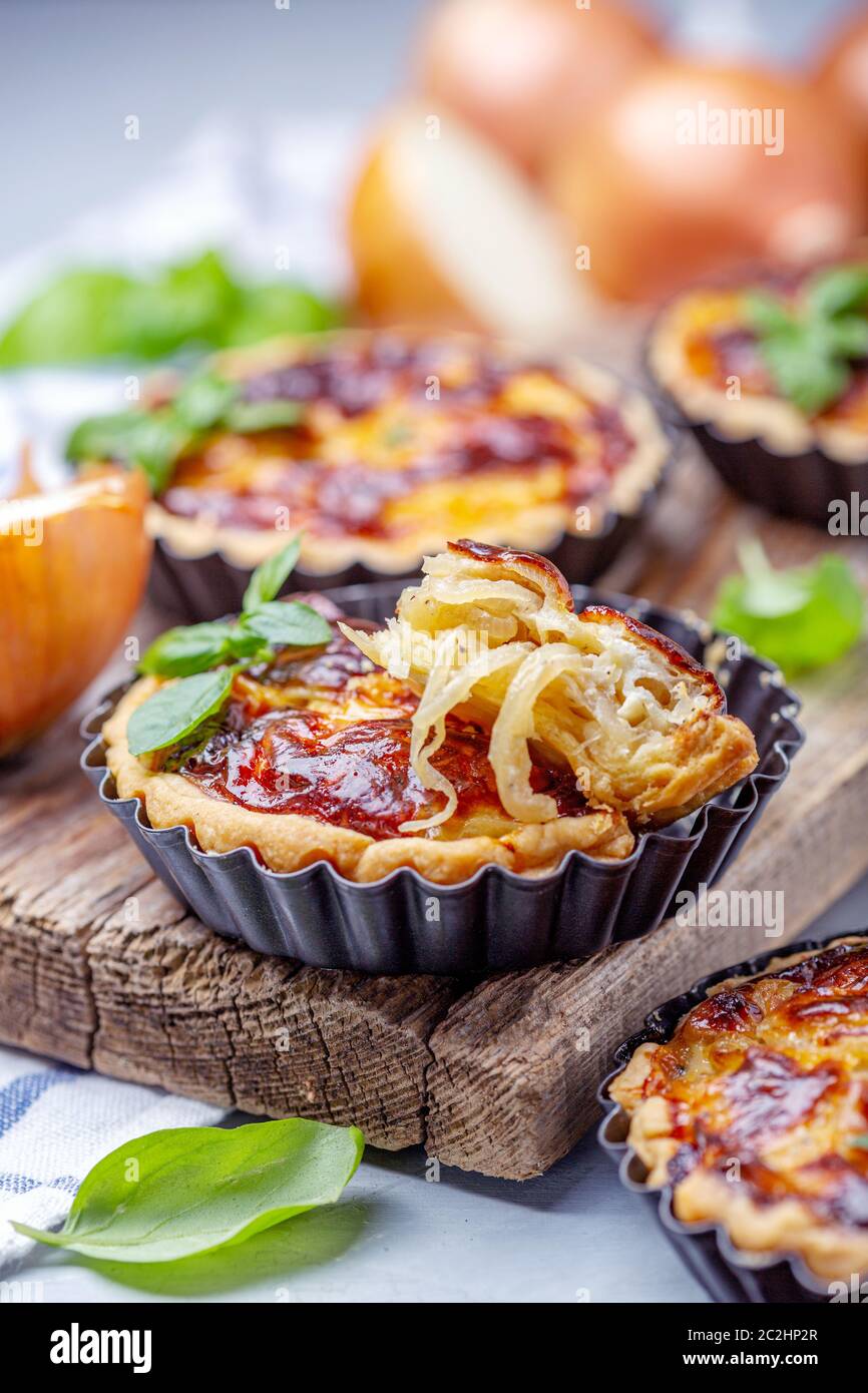 Homemade mini pies with onions. Stock Photo