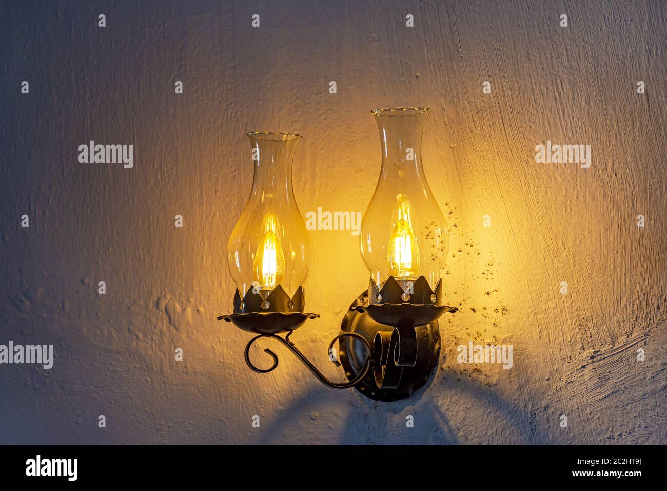 Two old lamps adapted for electric light Stock Photo