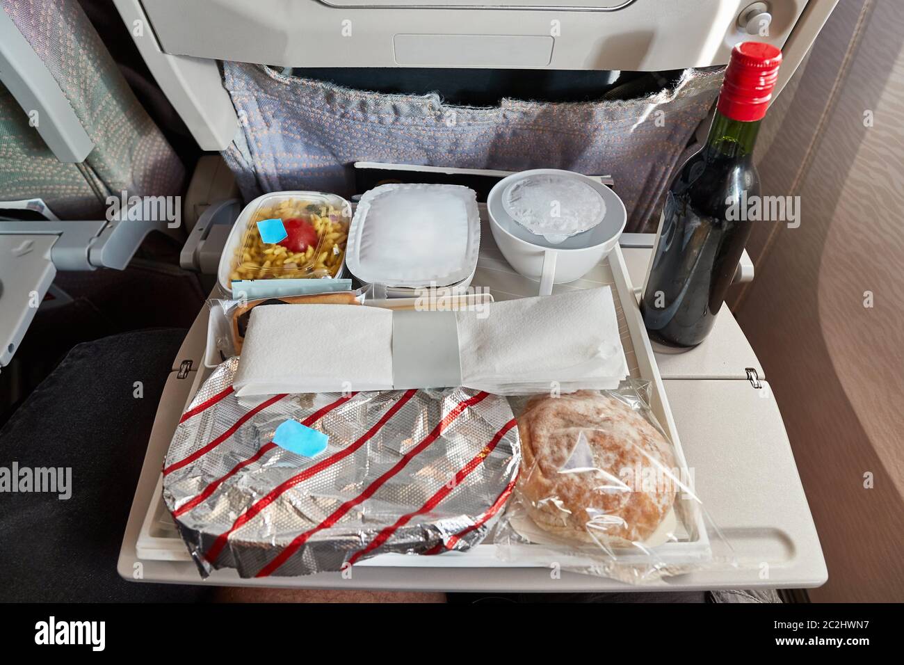 Airplane food provided on a long flight Stock Photo