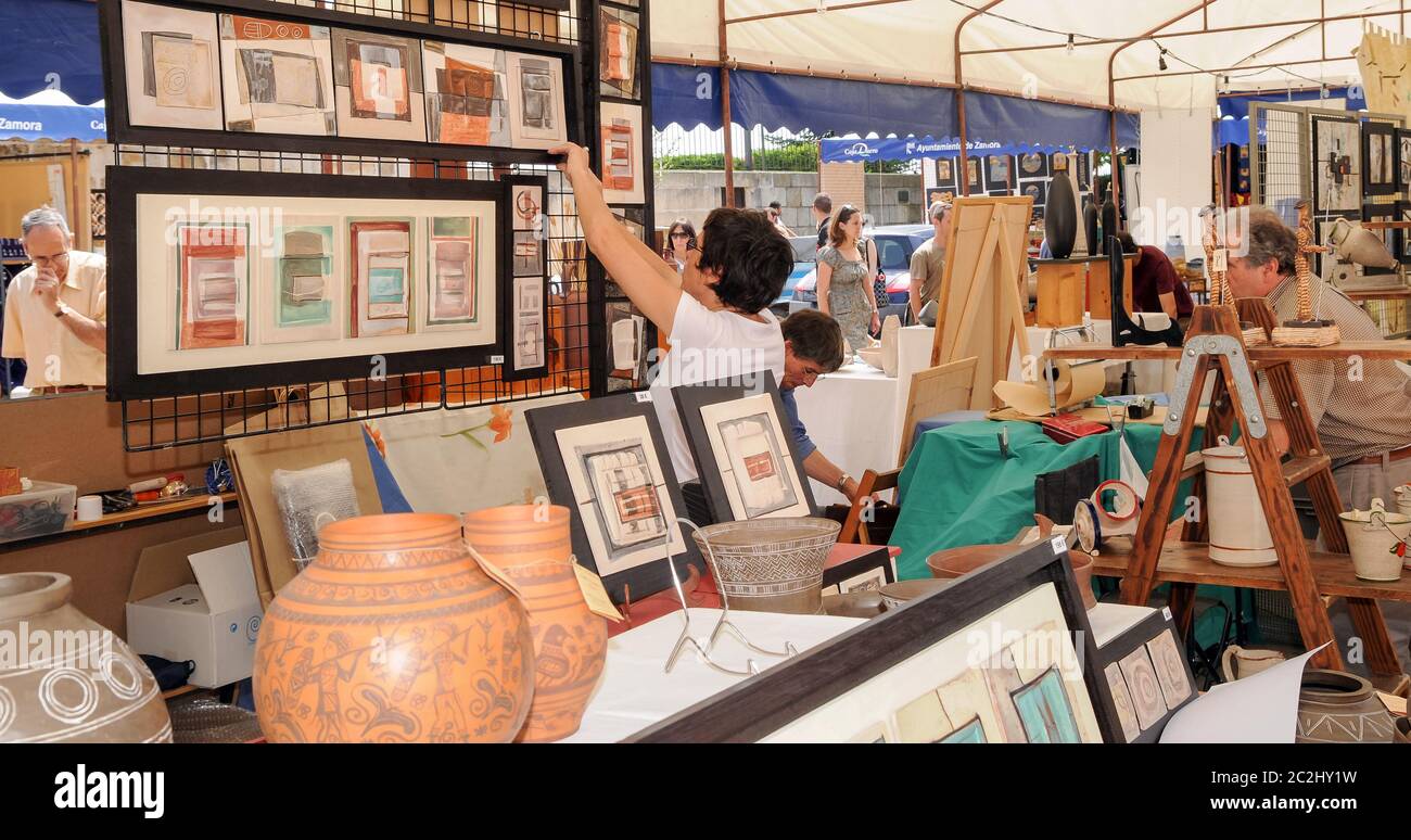 Ceramic paintings in a street stall of a ceramic fair in the city of Zamora. Stock Photo