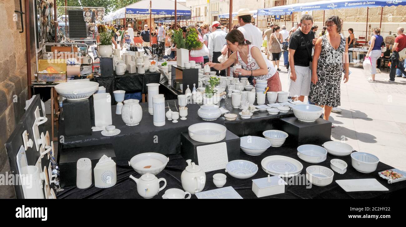 Ceramic bowls and pots on a street stall at a traditional ceramic fair ...