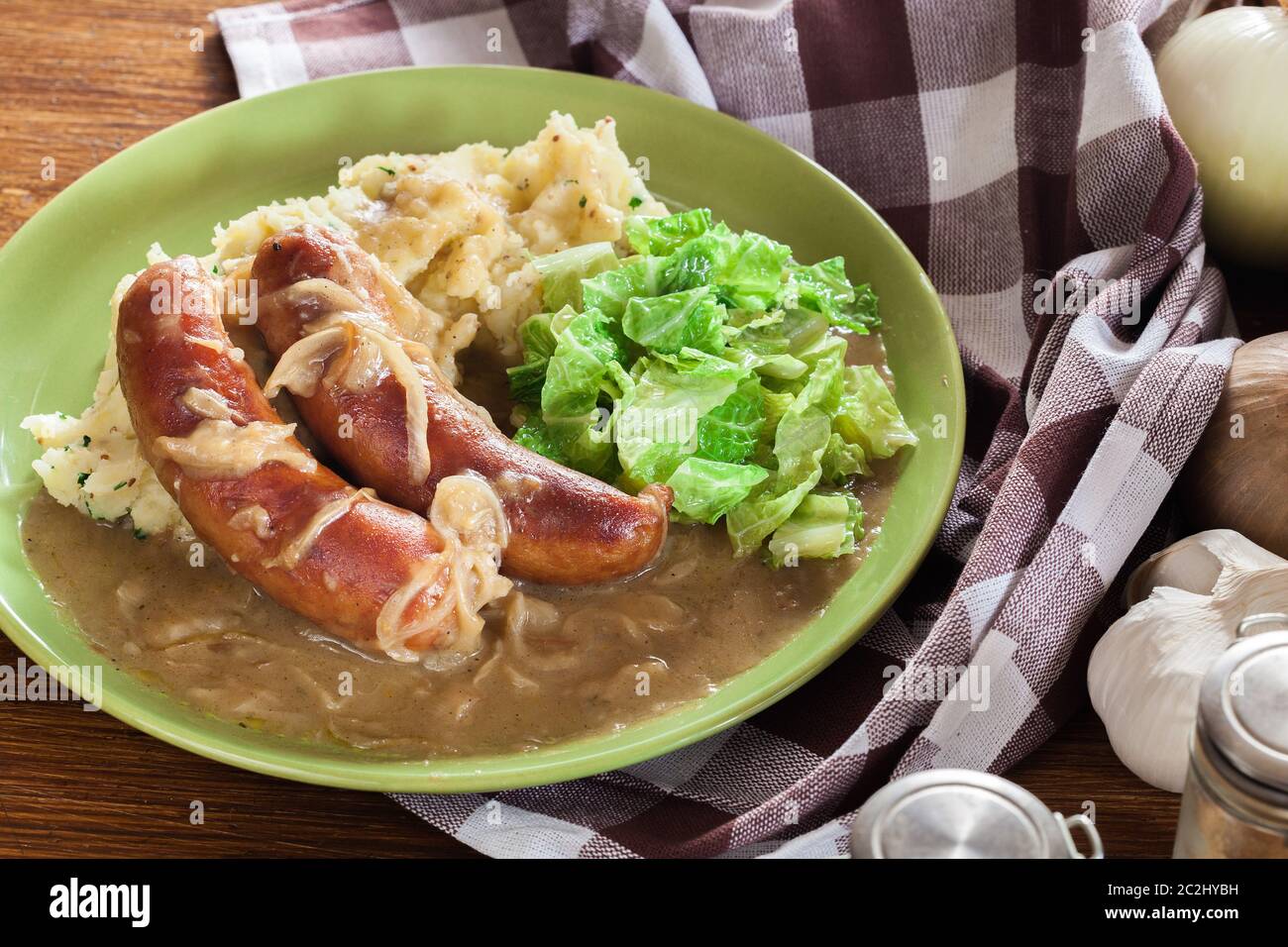Bangers and Mash. Baked sausage in onion gravy served with mashed