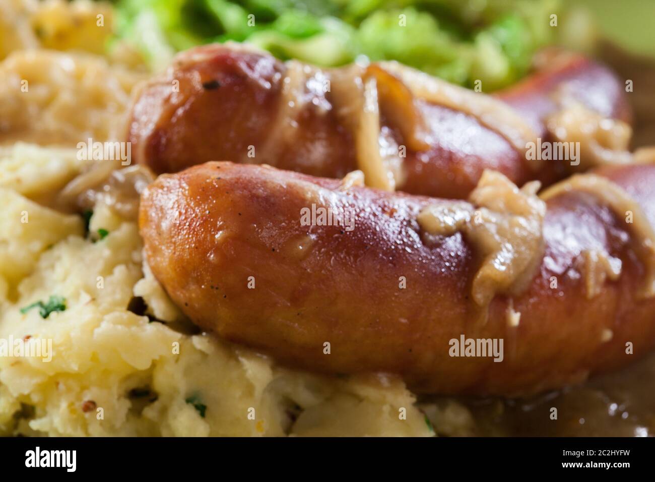 Bangers and Mash. Baked sausage in onion gravy served with mashed