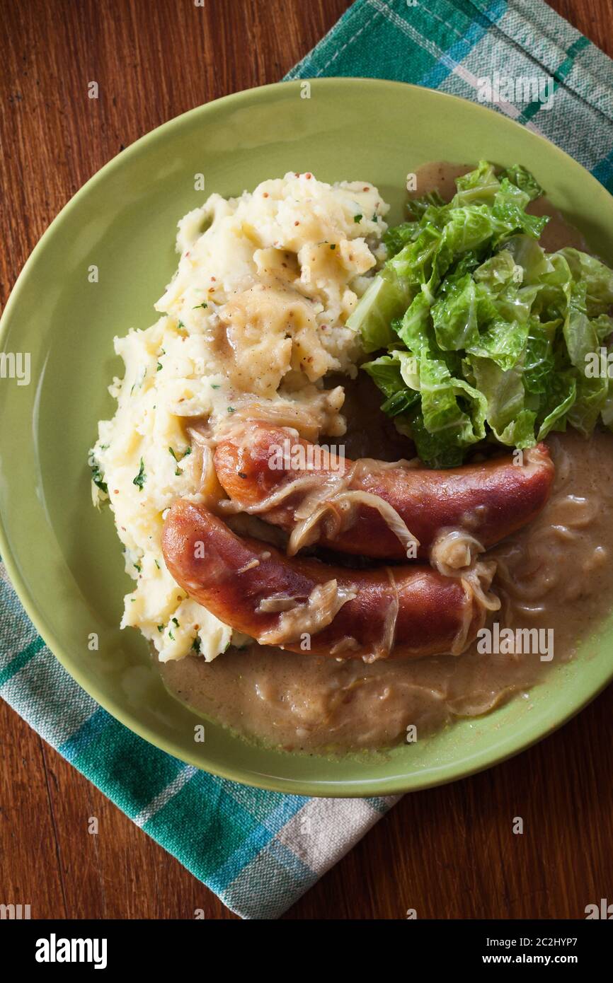 Bangers and Mash. Baked sausage in onion gravy served with mashed