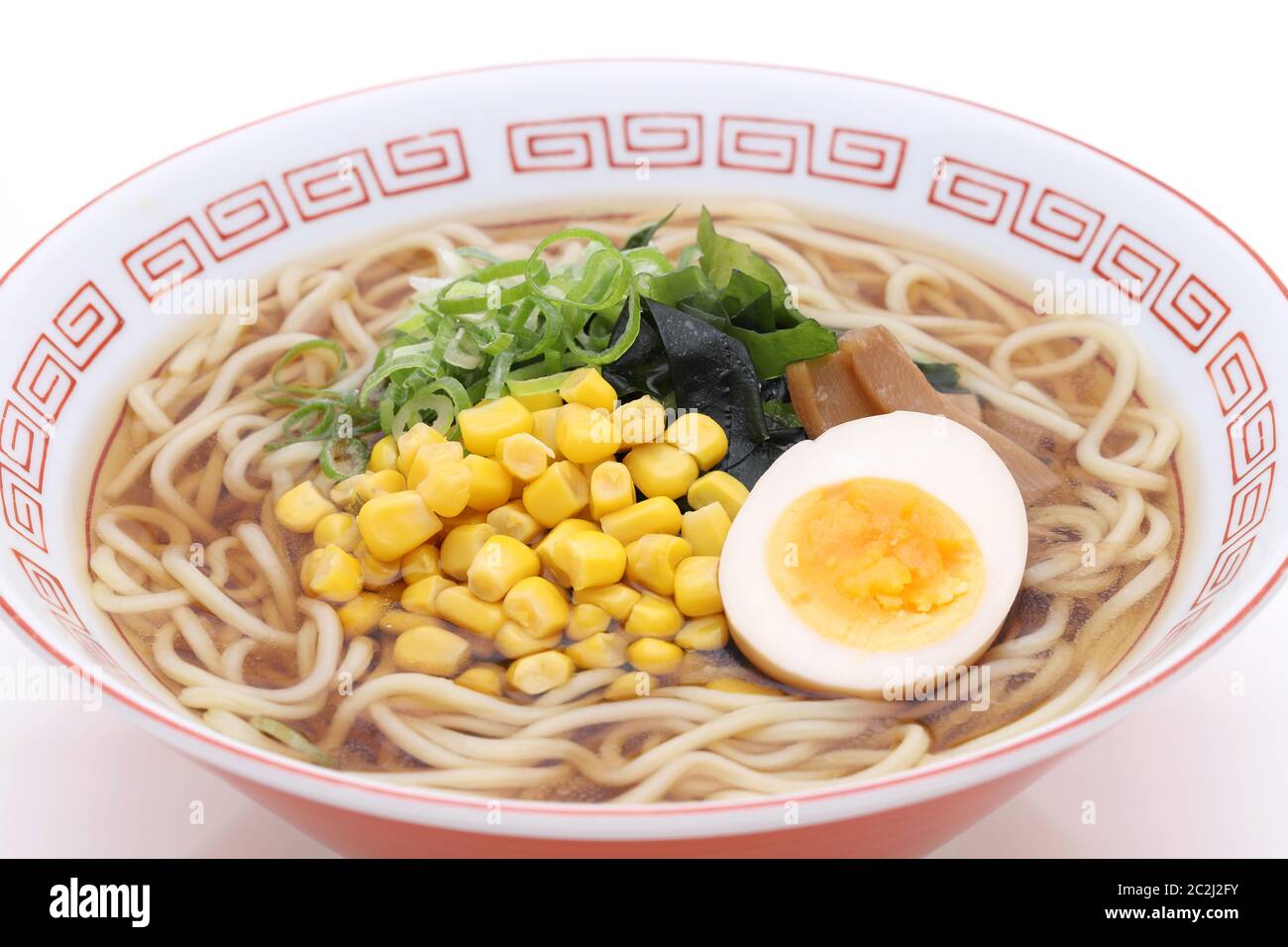 Japanese Soy sauce ramen noodles in a bowl on white background Stock