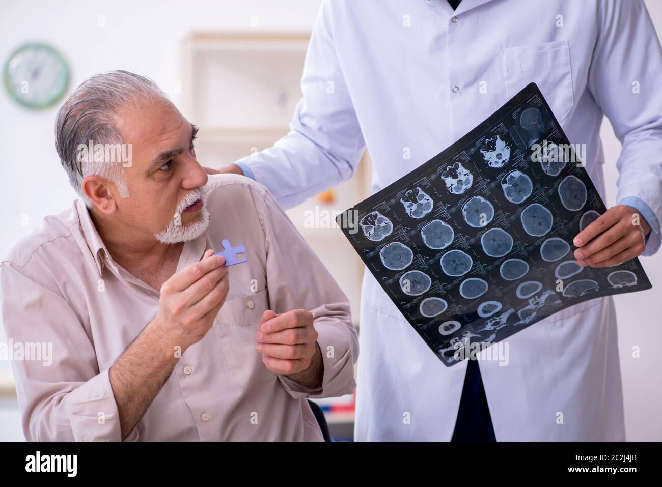 Doctor and patient suffering from the Alzheimer disease Stock Photo