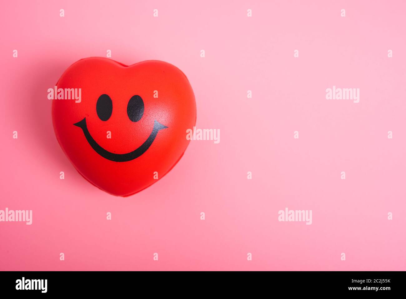 Red heart on pink background with copy space, valentine day concept ...