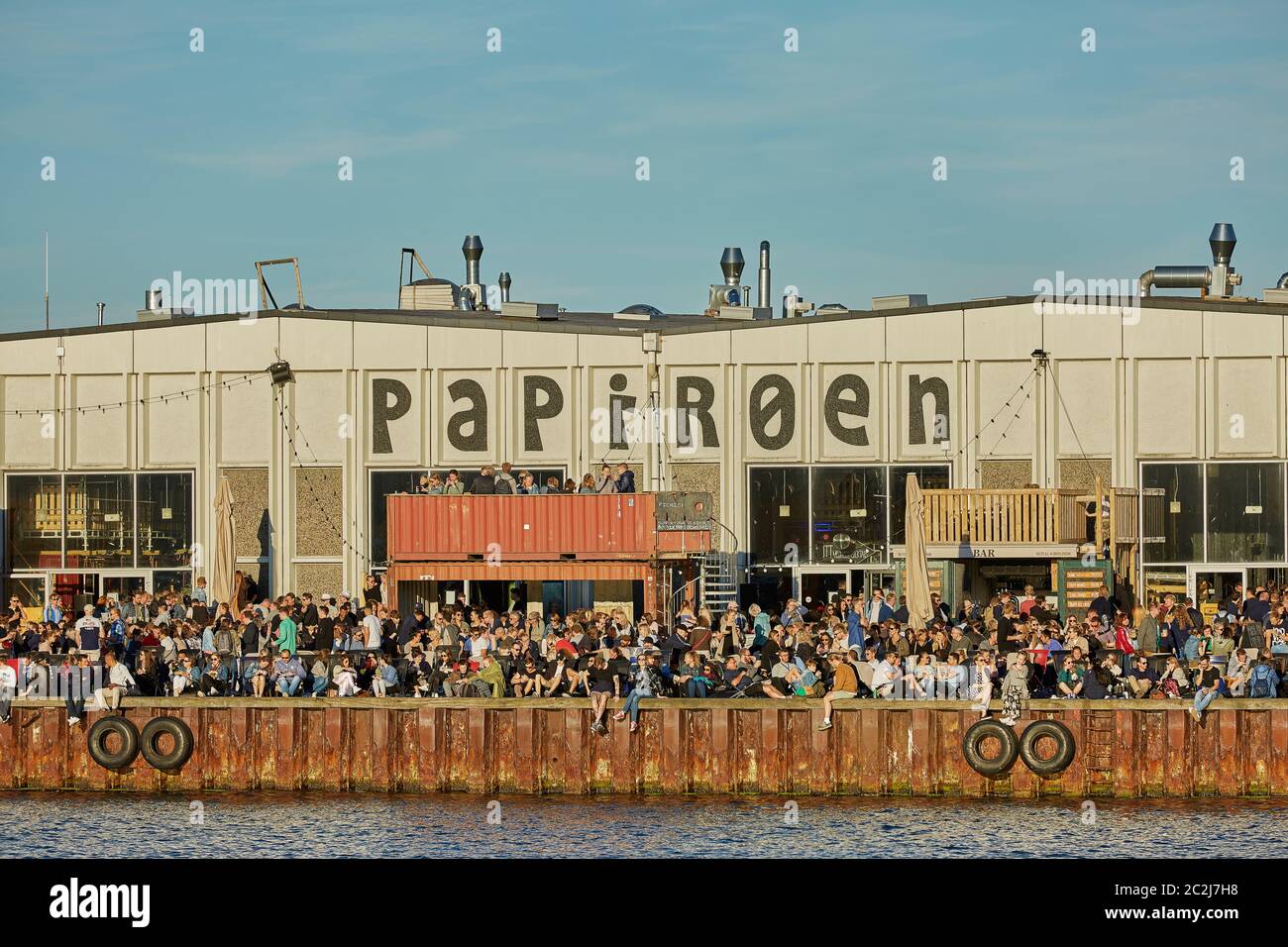 Street food market Papiroen on the paper island in Copenhagen with a lot of  people on the quay Stock Photo - Alamy