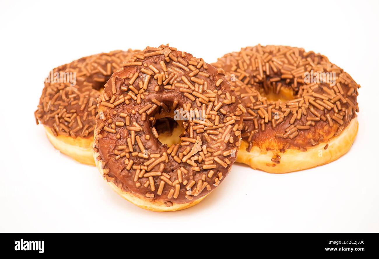 Chocolate doughnuts on a white background Stock Photo - Alamy