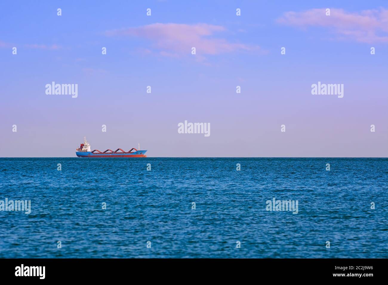 Cargo Ship in the Sea Stock Photo