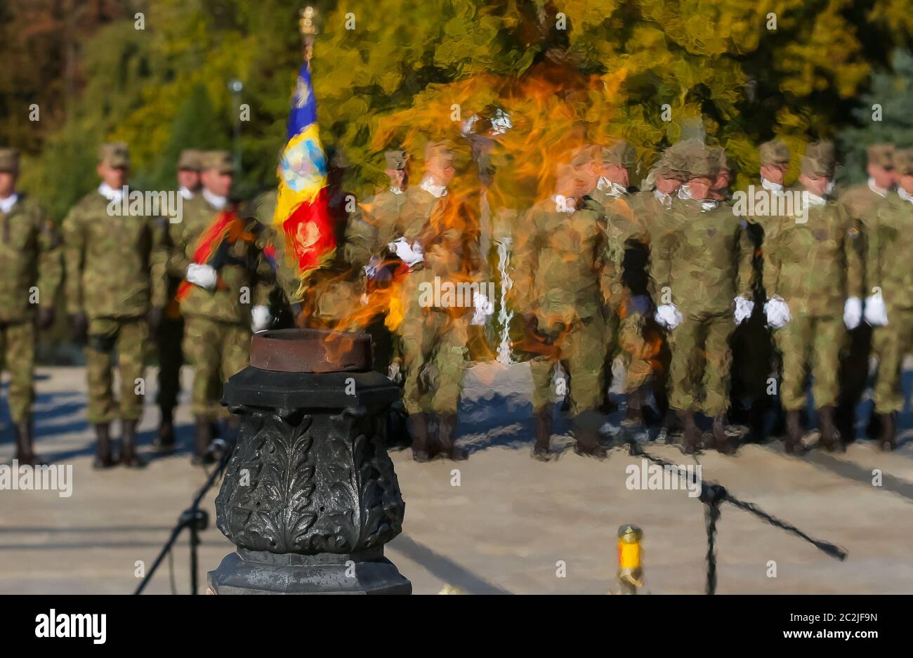 Bucharest, Romania - October 25, 2018: The elite troops of the Romanian army infantry are seen through the eternal flame that burns at the grave of th Stock Photo