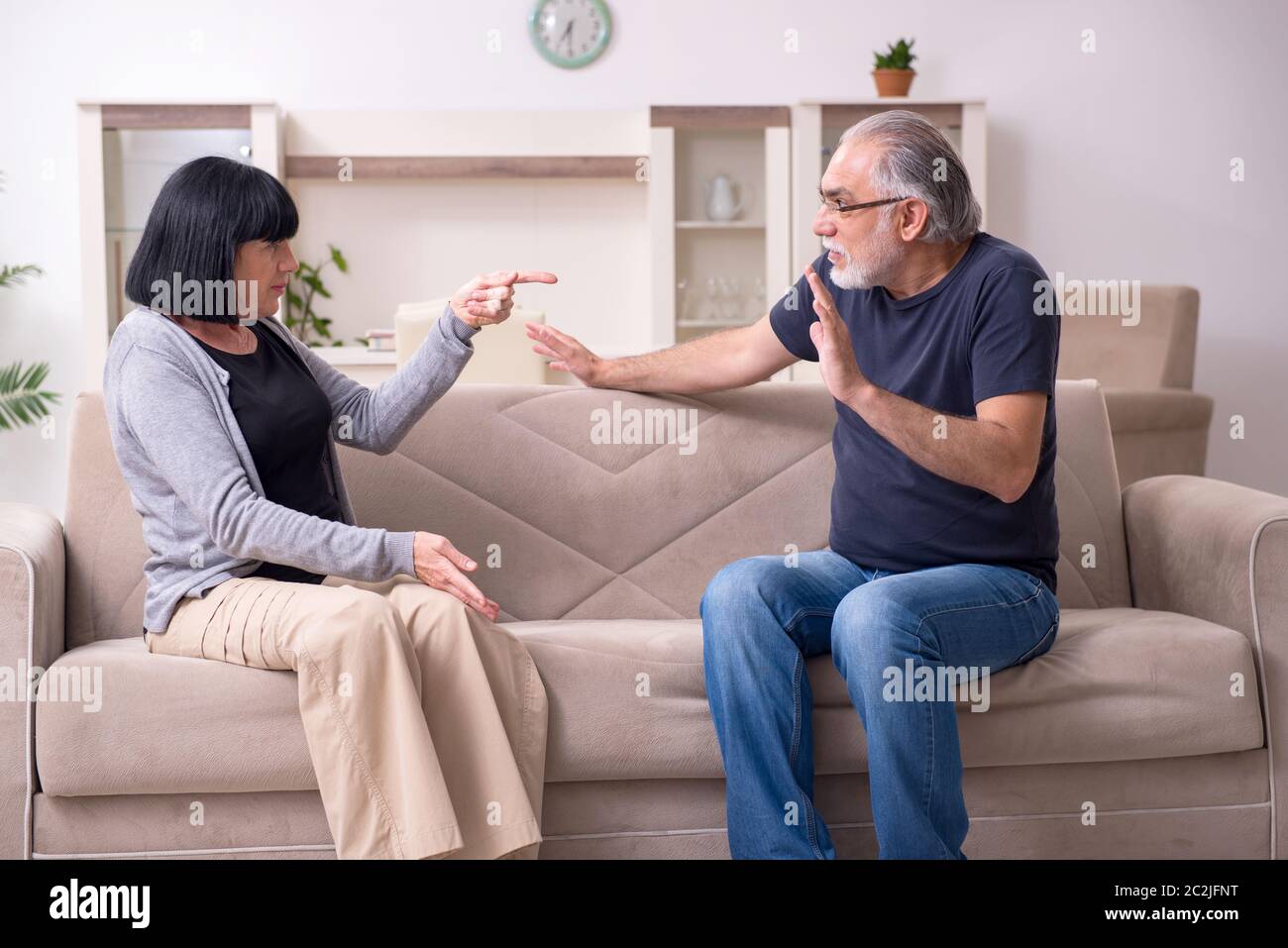 Old couple having argument at the home Stock Photo - Alamy
