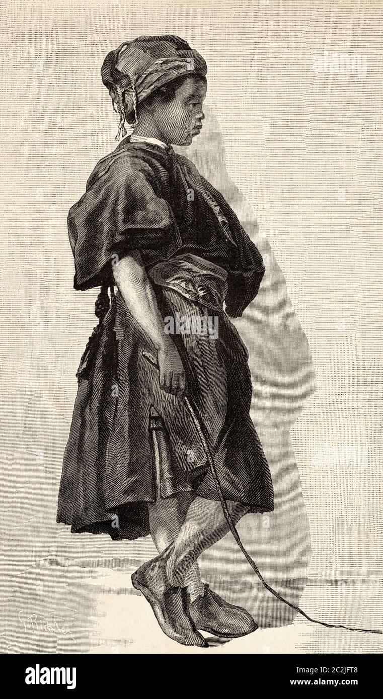 Young Egyptian camel driver dressed in typical clothing, Ancient Egypt. Old 19th century engraved illustration, El Mundo Ilustrado 1880 Stock Photo