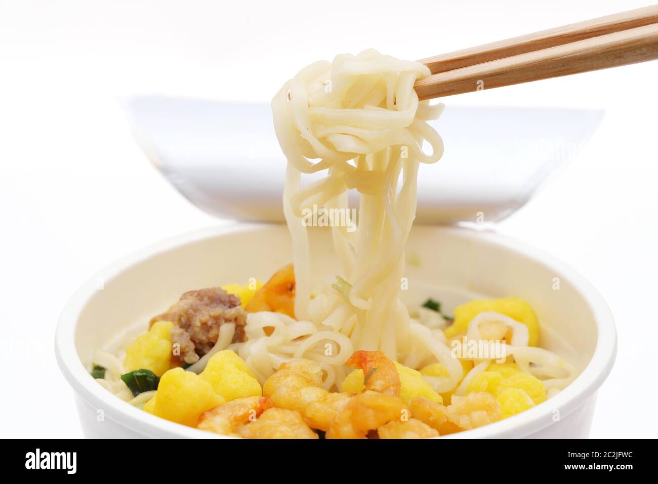 Instant noodles, noodle soup in a cup with chopsticks Stock Photo Alamy