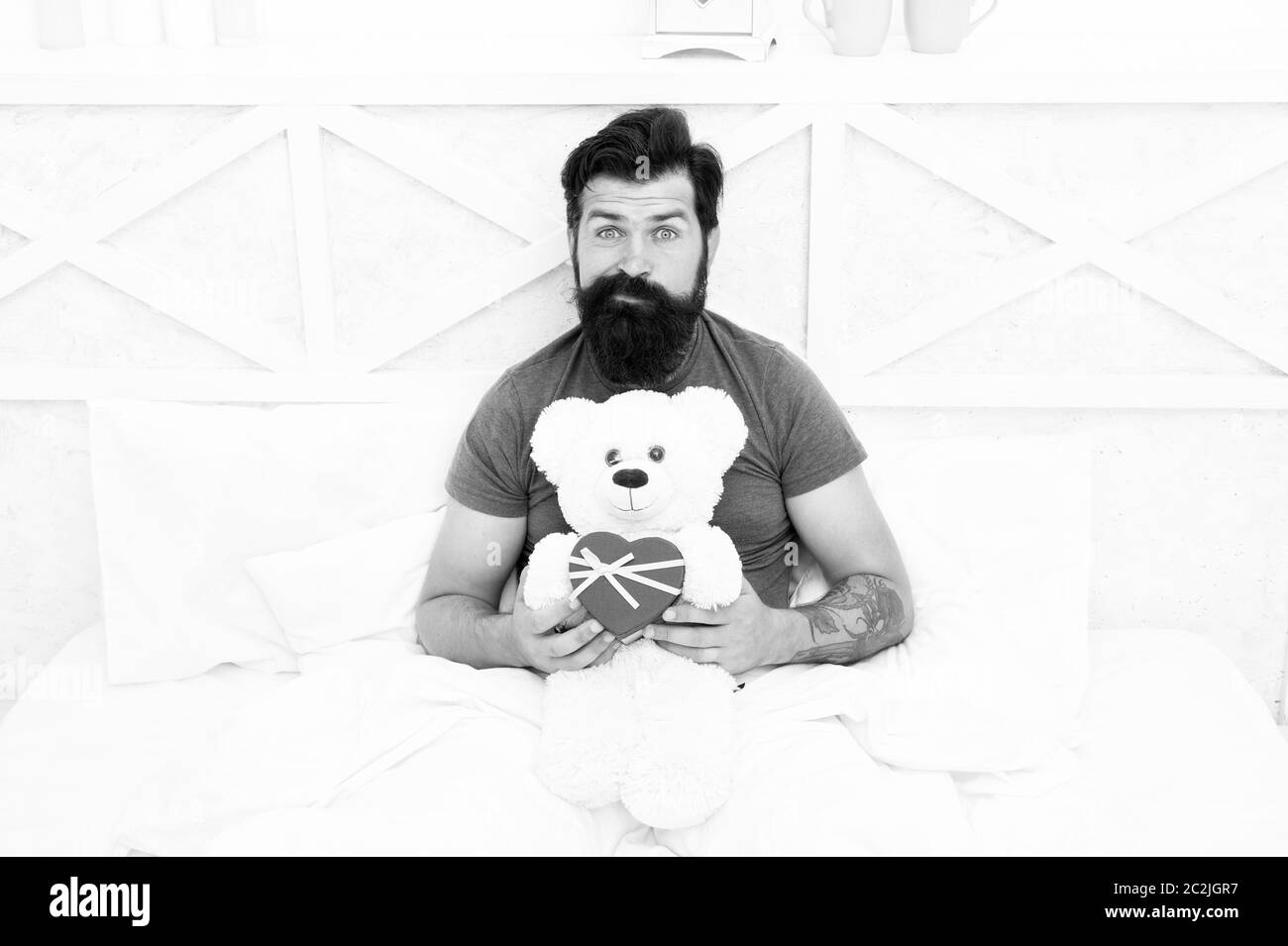 Excitement. bearded man teddy bear in bed. Gift box for holidays. nice present for you. Valentines day morning. my birthday. Happy adulthood. home shopping concept. Love and happiness. Stock Photo