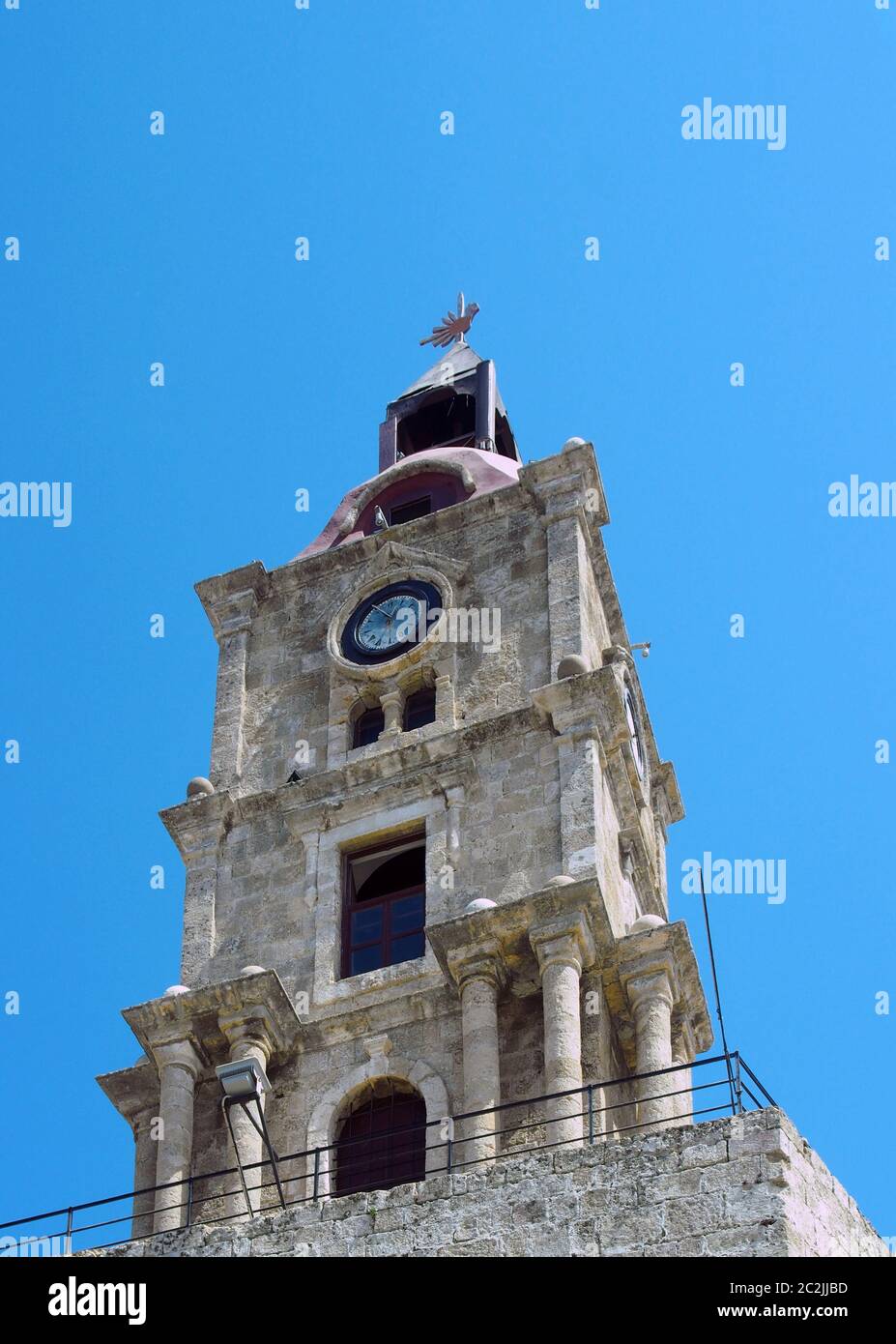 Roloi the historic roloi medieval clock tower in rhodes town against a blue ...