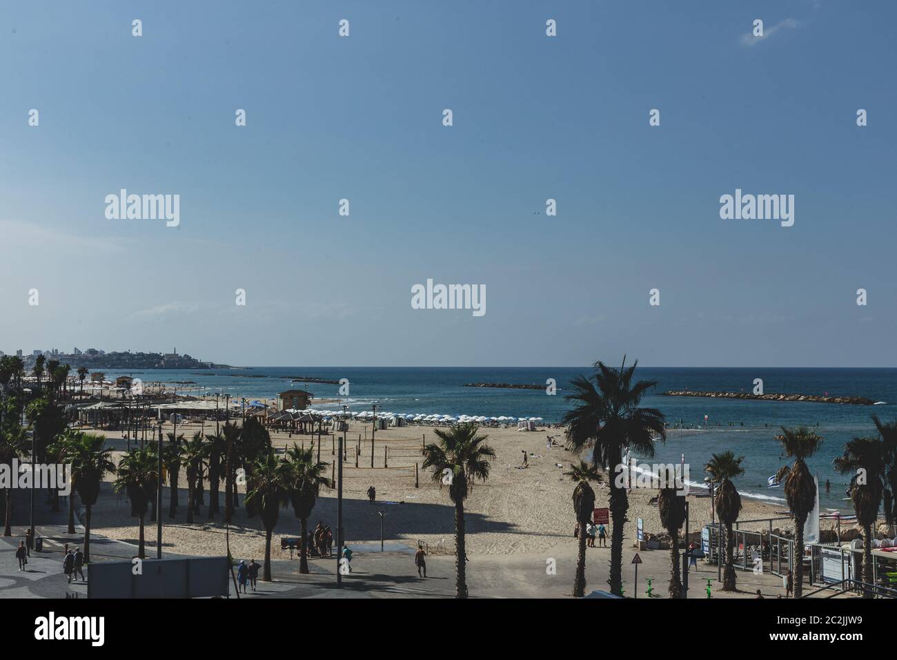 Tel Aviv/Israel-10/10/18: beaches along the Tel Aviv Promenade and Mediterranean shoreline. Ancient port city Jaffa on the background Stock Photo