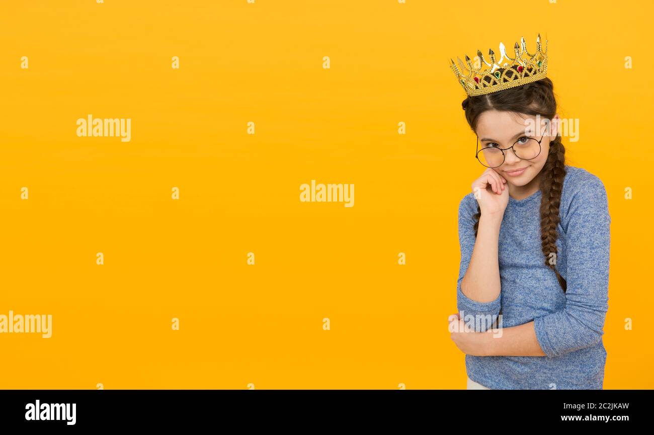 Salon giving you status. Small child wear crown and glasses. Eyewear salon  store. Little princess with long hair. Hair salon. Beauty salon. Kids  barber. Hairdresser is girls best friend, copy space Stock