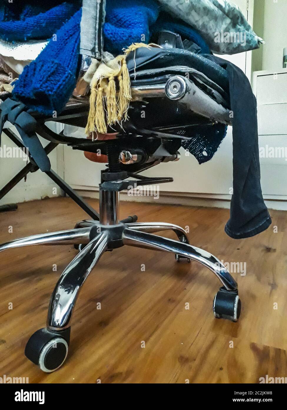 Chair with Clothes at Room Stock Photo Alamy