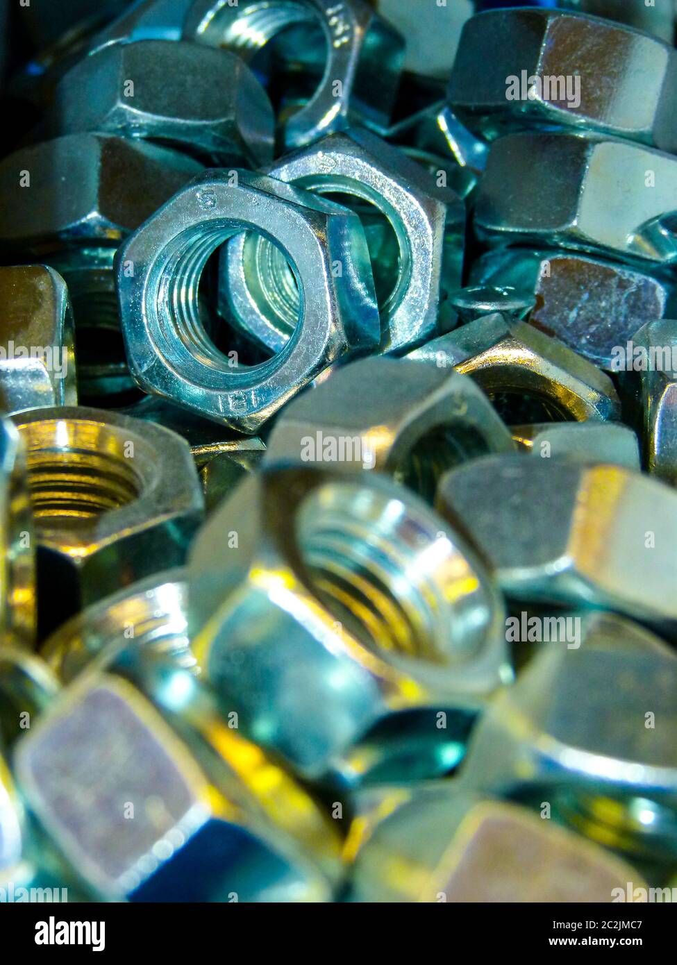 Hexagon nuts loose in sale box Stock Photo