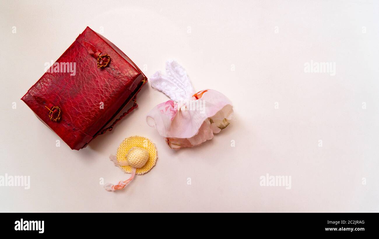toy red suitcase sundress and hat Stock Photo