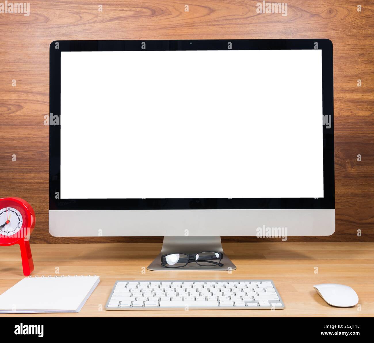 Office monitor computer, mouse on wood table and wooden wall background