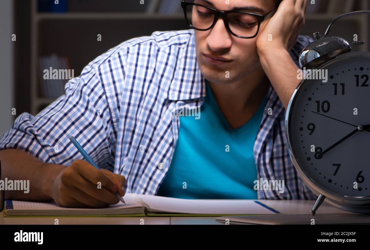 Student preparing for exams late night at home Stock Photo - Alamy