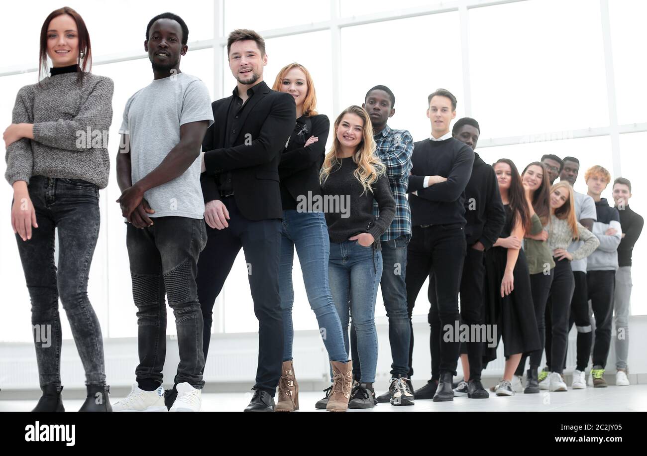 group of serious young people standing in line Stock Photo - Alamy