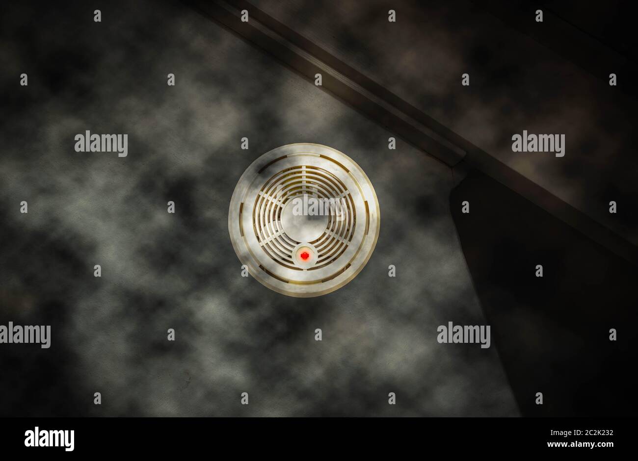 Smoke detector on the wall with red warning light sensor and smoke ...
