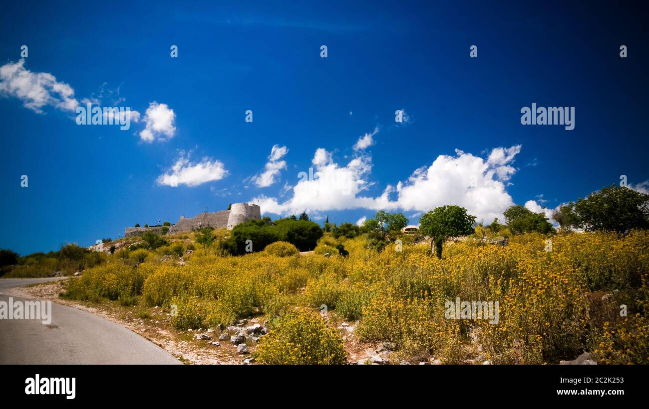 Landscape with the Lekuresi Castle and military bunkers, Saranda, Albania Stock Photo