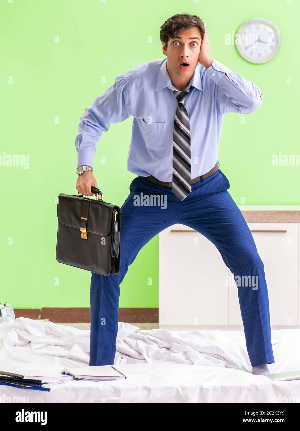 The young businessman employee late for office Stock Photo